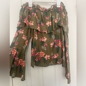 Straight front long sleeve blouse with flower design and spaghetti strap top.